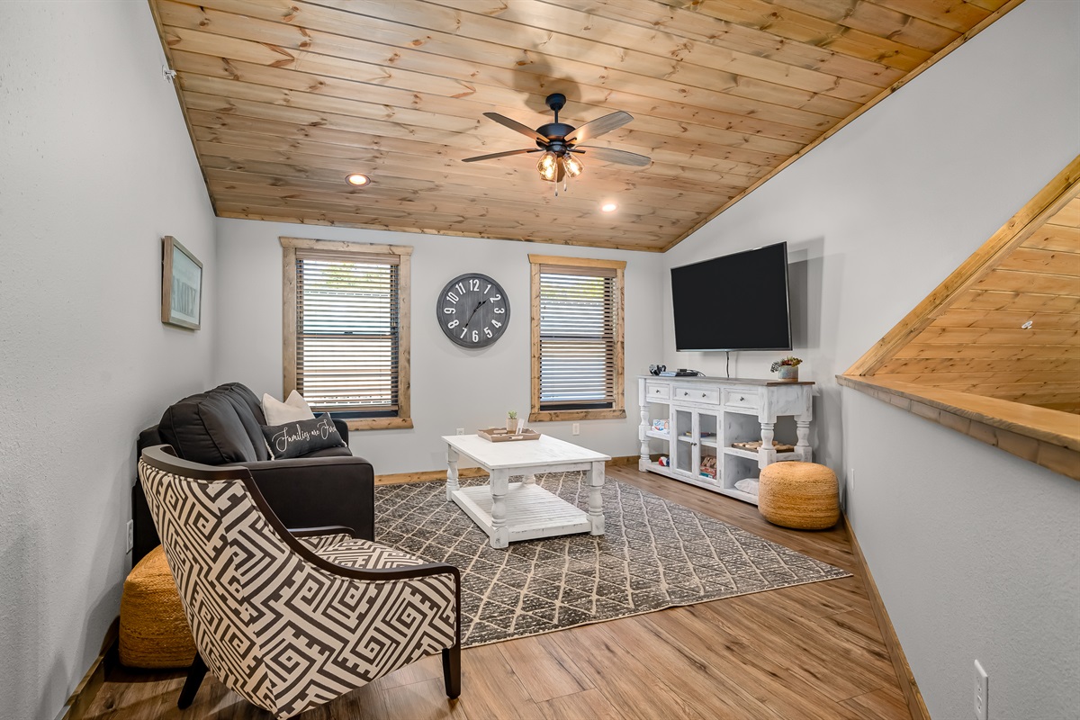 Upper floor loft space with PS4 and queen sleeper sofa