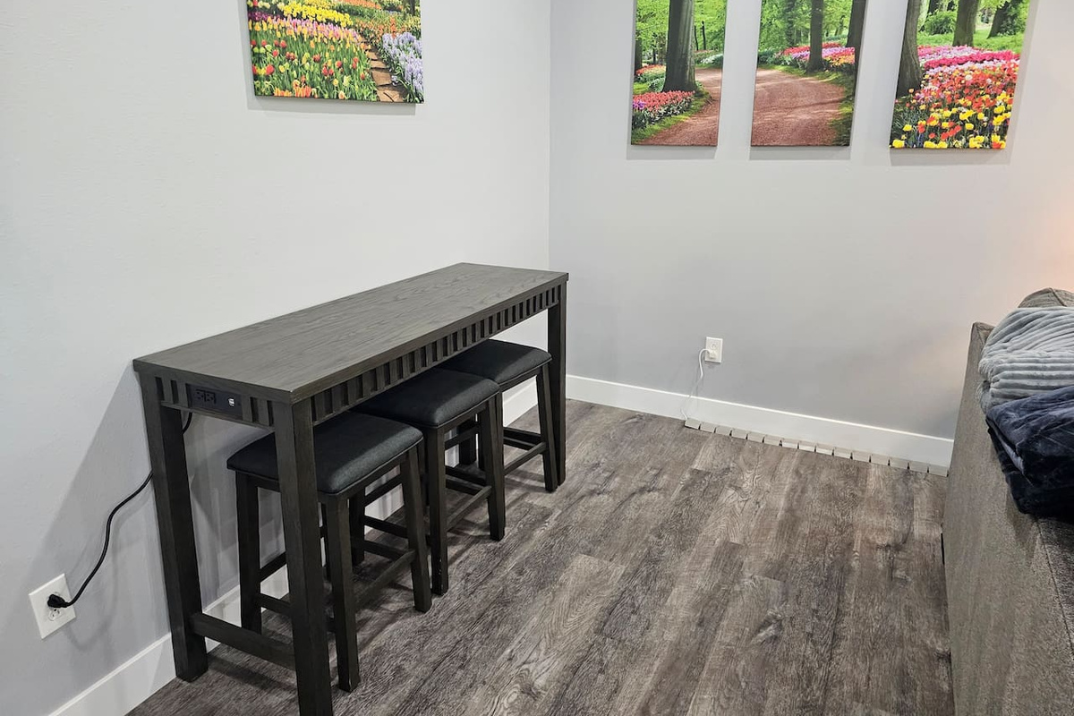 Convenient bar‑height table with built in power - perfect for a dedicated workspace during your stay.