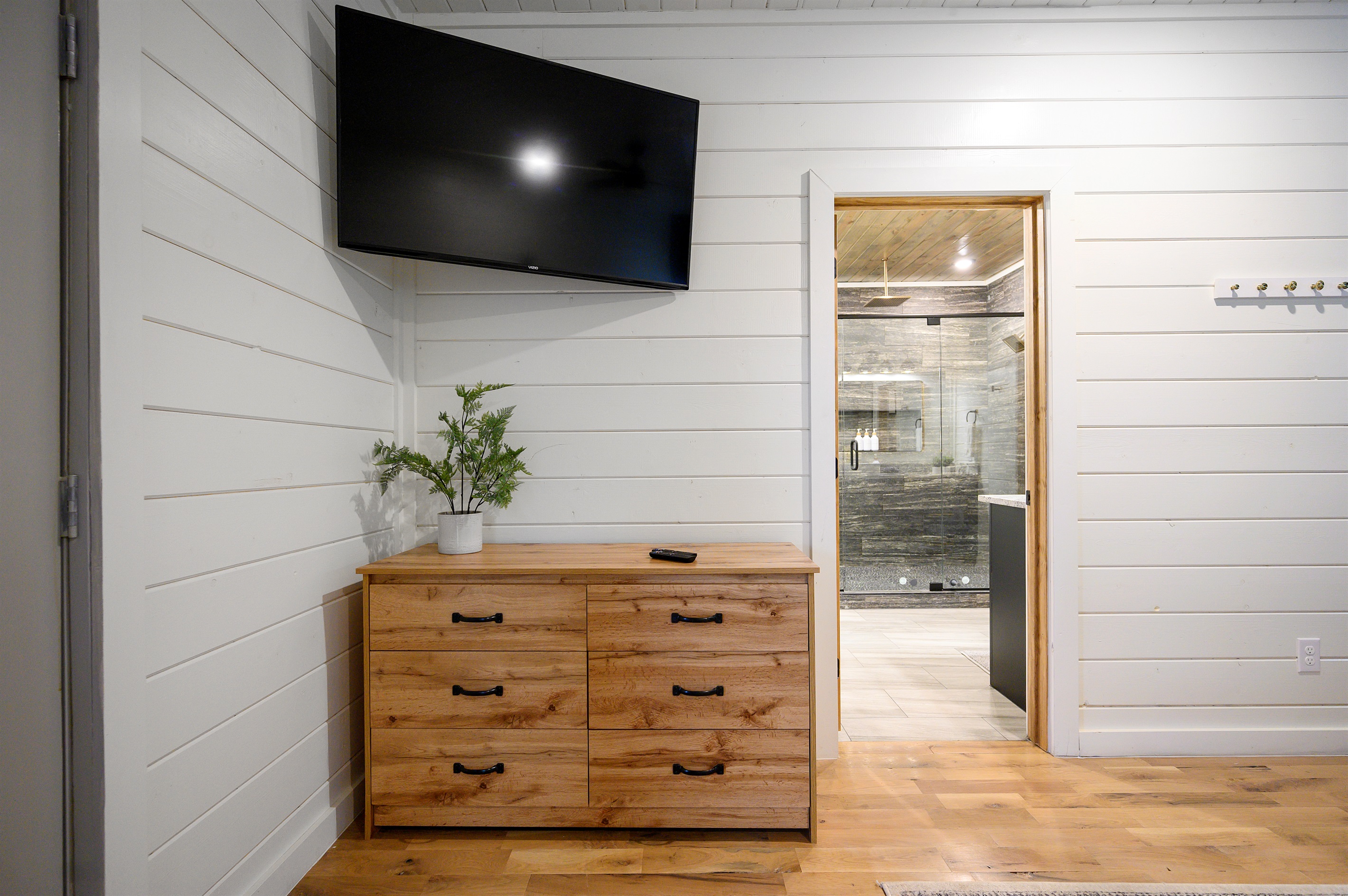 A storage drawer and a TV for convenience and easy relaxation. ✨