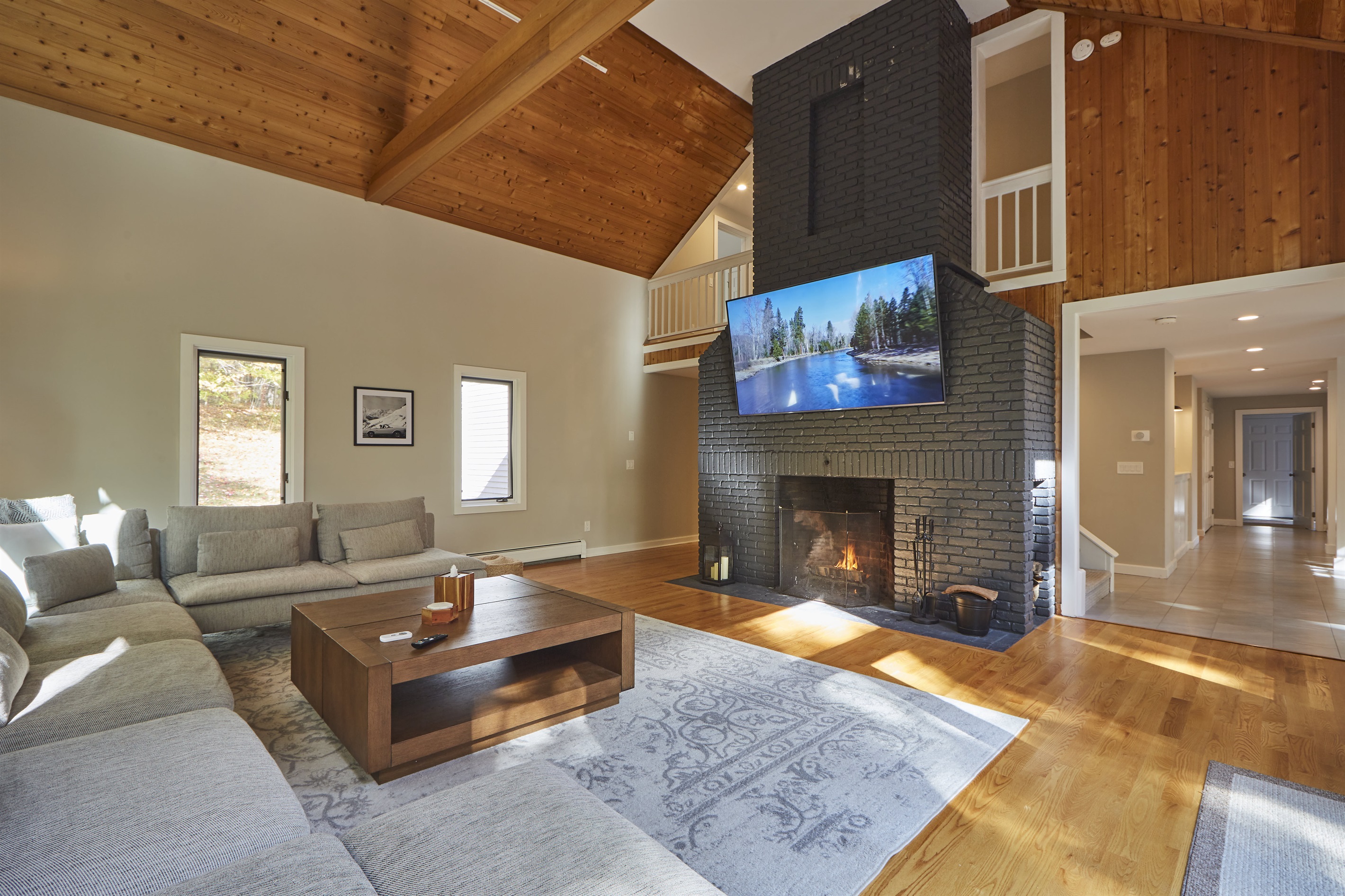 Settle in by the fire and savor the open, airy feel of the living room's soaring vaulted ceilings.