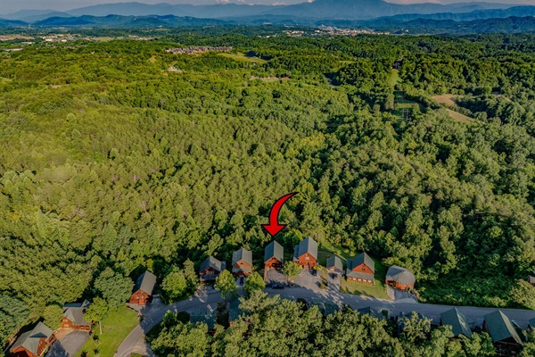 A little slice of heaven, perfectly placed within a majestic mountain backdrop.
