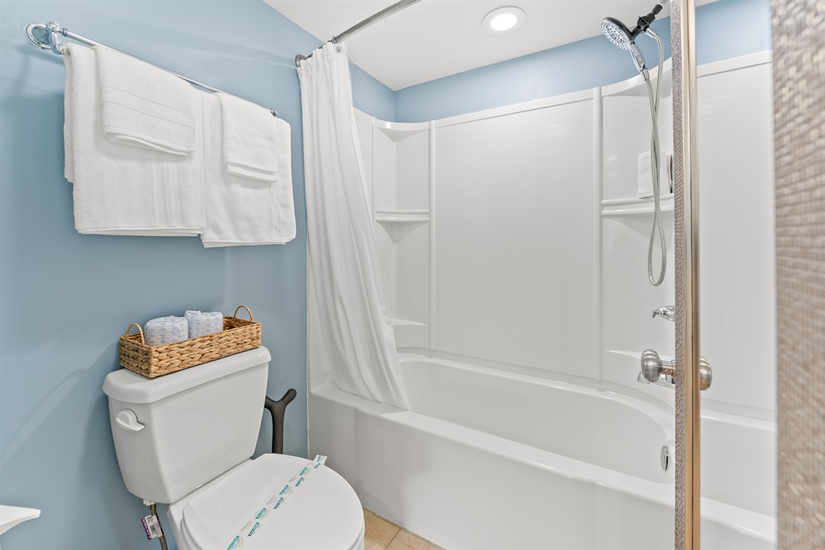 Main Bathroom with double sinks and tub/shower combo