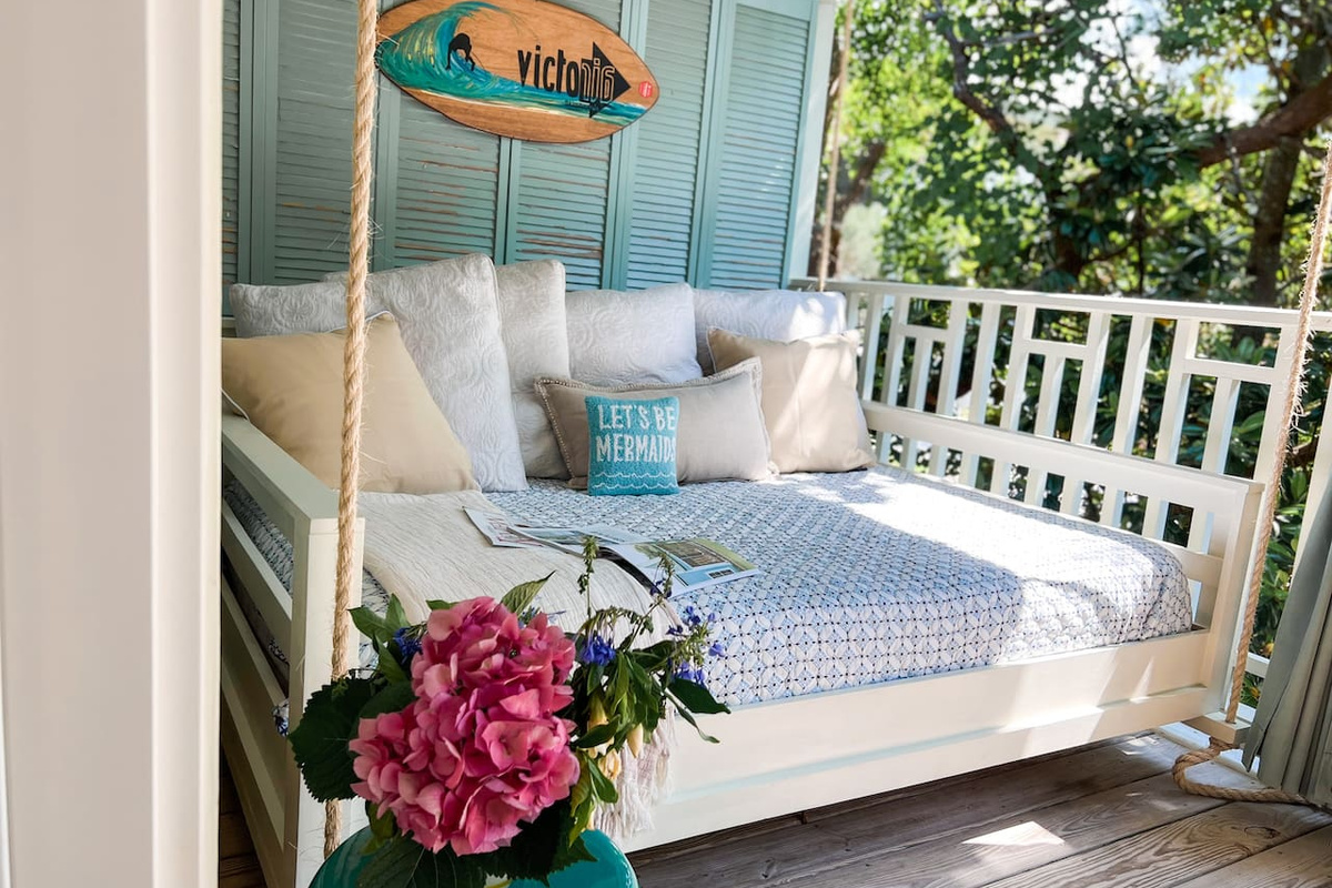 Cozy full sized swinging bed on the front deck perfect for a nap or a book!