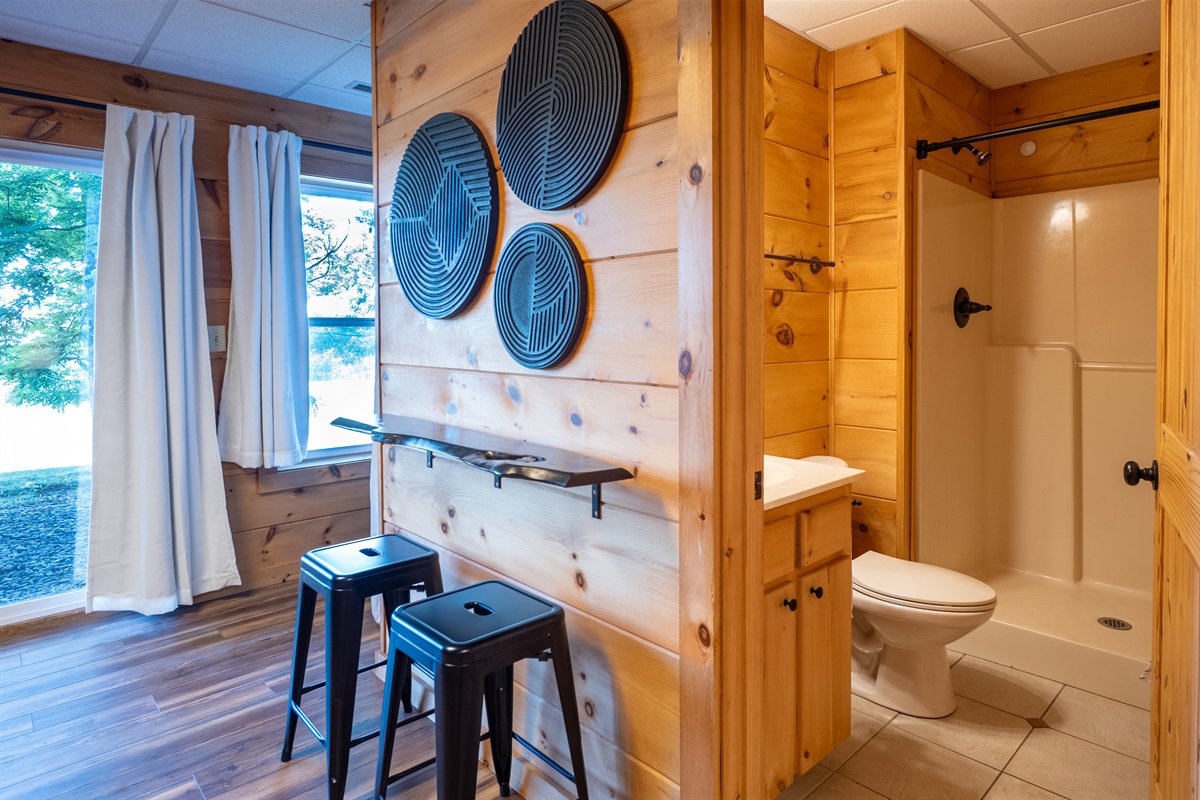 Convenience and comfort extend to the lower level with a full bathroom easily accessible from the living and game areas