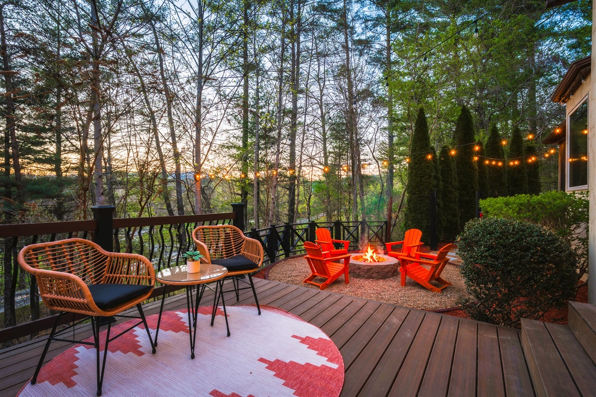 Private deck seating with sunset views - one of many spots to take in Asheville’s natural beauty