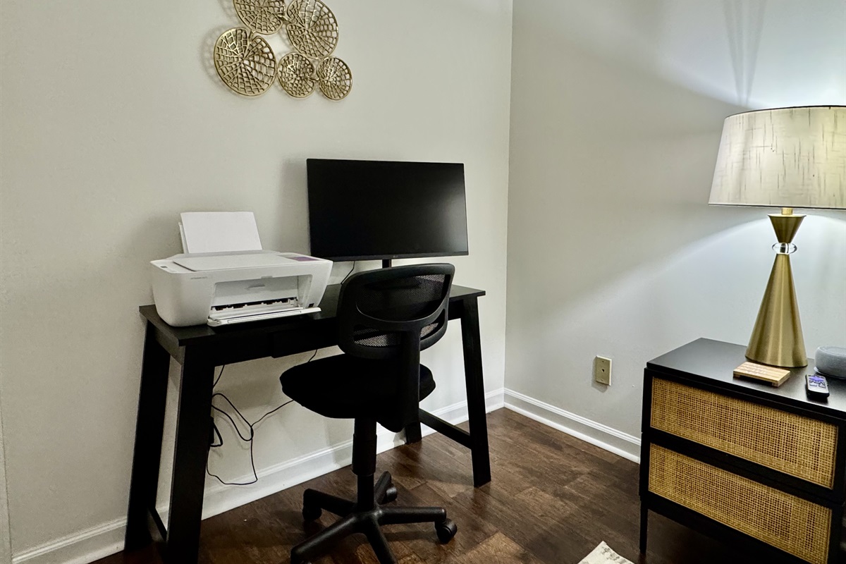 Newly added computer desk, monitor, and printer for guests use