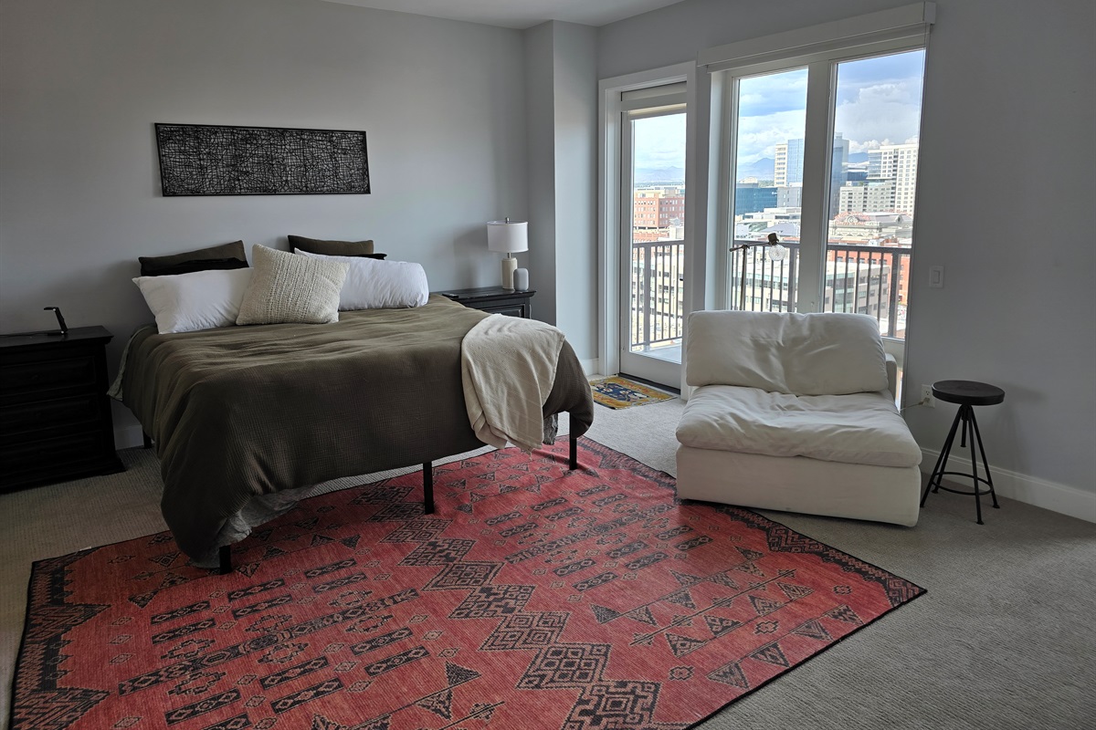 King size bed, extra seating area, private balcony with seating.