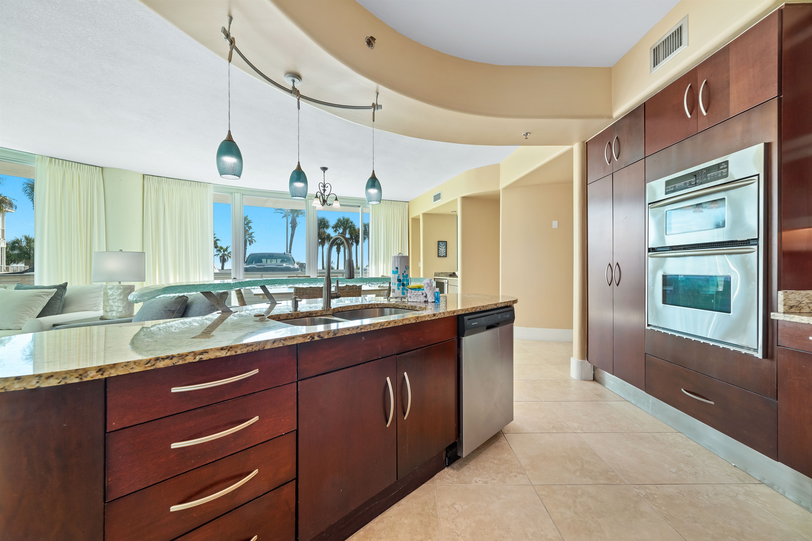 Effortless flow and abundant natural light characterize this stunning condo. The kitchen's thoughtful design and open layout create an inviting atmosphere for both cooking and gathering.