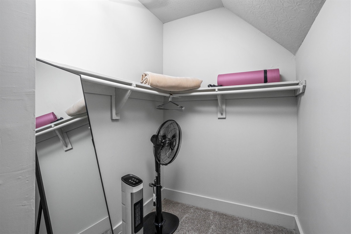 Store your belongings and clothes in the expansive primary bedroom closet.