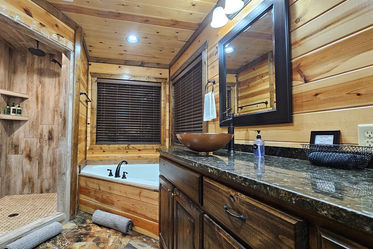 Luxurious Spa Retreat: Indulge in a serene soak or refresh under the rain shower in nature's embrace!