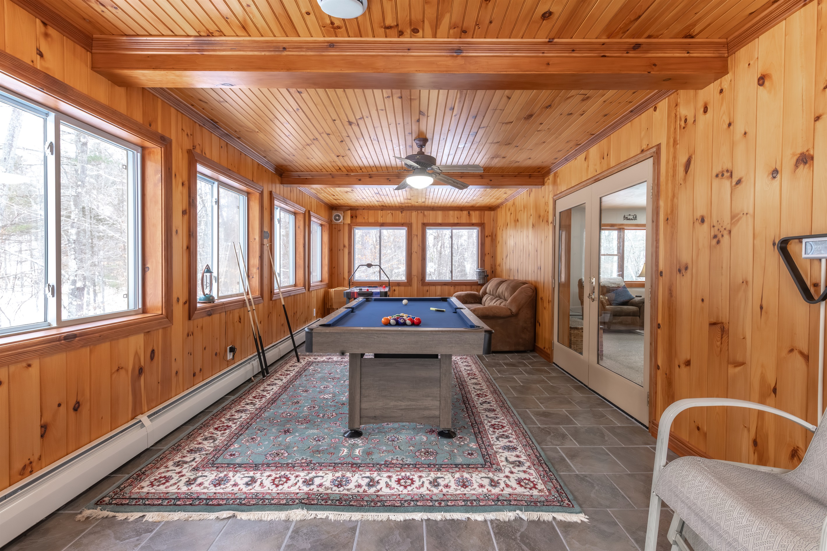 Shoot some pool, play some air hockey or just take it easy on the couch and watch all the action!