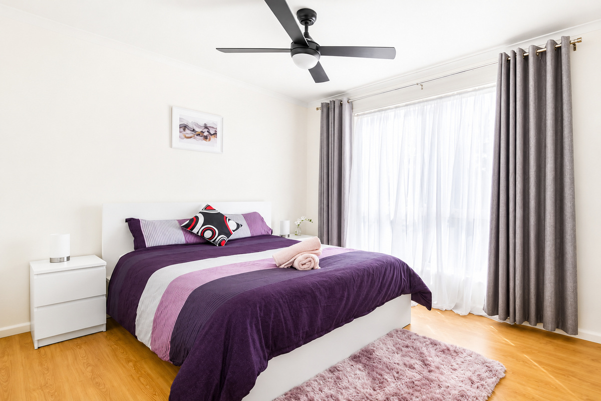 1 Double bed Bedroom - The double bedroom at Carlenes Getaway has soft natural light, a ceiling fan and simple comfort for a restful Loch Sport stay.