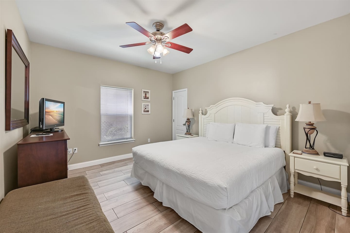 BEDROOM #1: King Bed with nightstands, dresser, and TV. (located on the 1st floor)