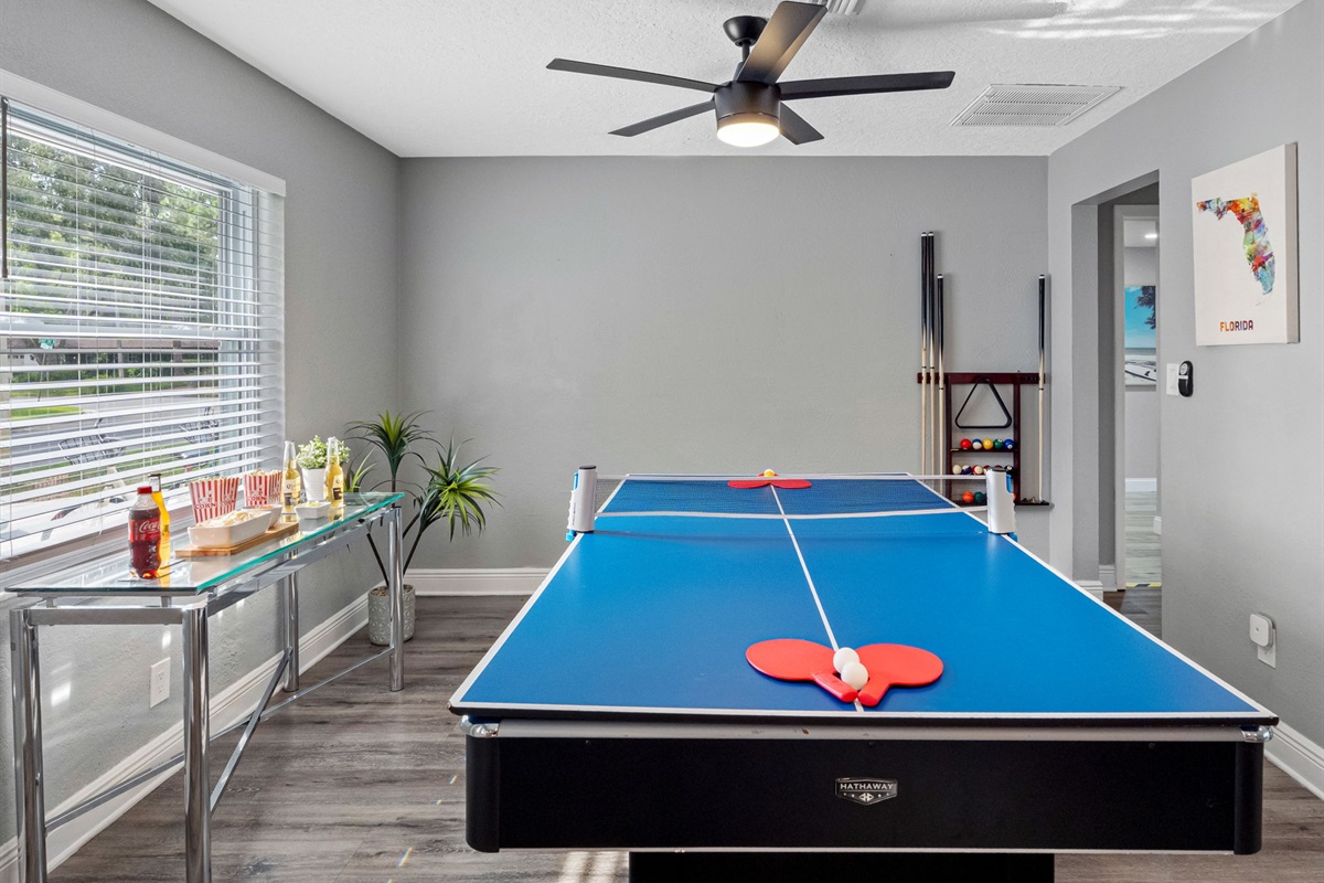 This lively game room invites friendly competition with a full-size pool table, ping pong setup, and plenty of space to gather and cheer each other on.