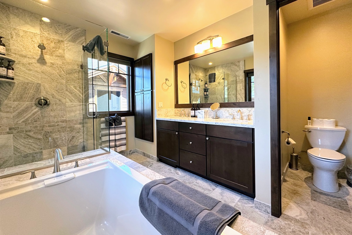Step into your own spa retreat with a deep soaking tub, walk-in shower, and private toilet room—designed for unwinding in total comfort and style.