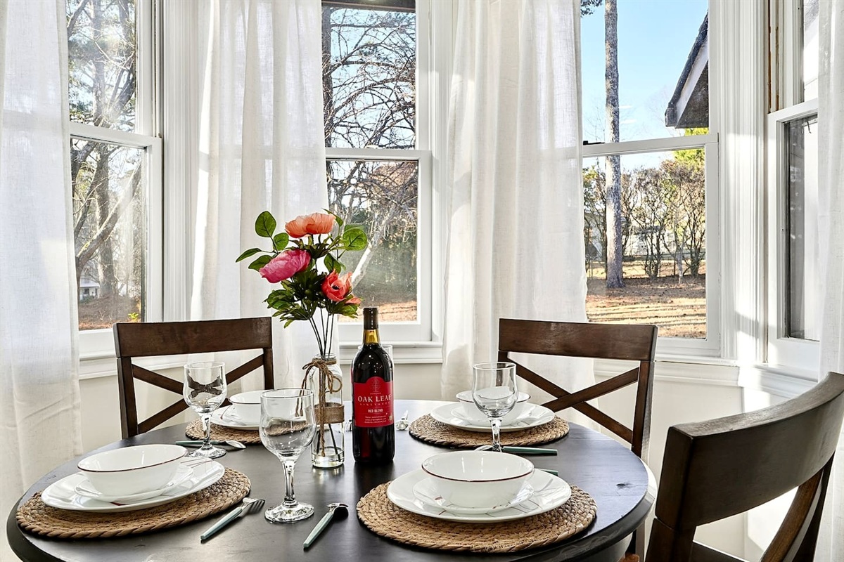 Charming kitchen-side breakfast nook with seating for four. A cozy spot for coffee, breakfast, or casual conversations with family and friends.