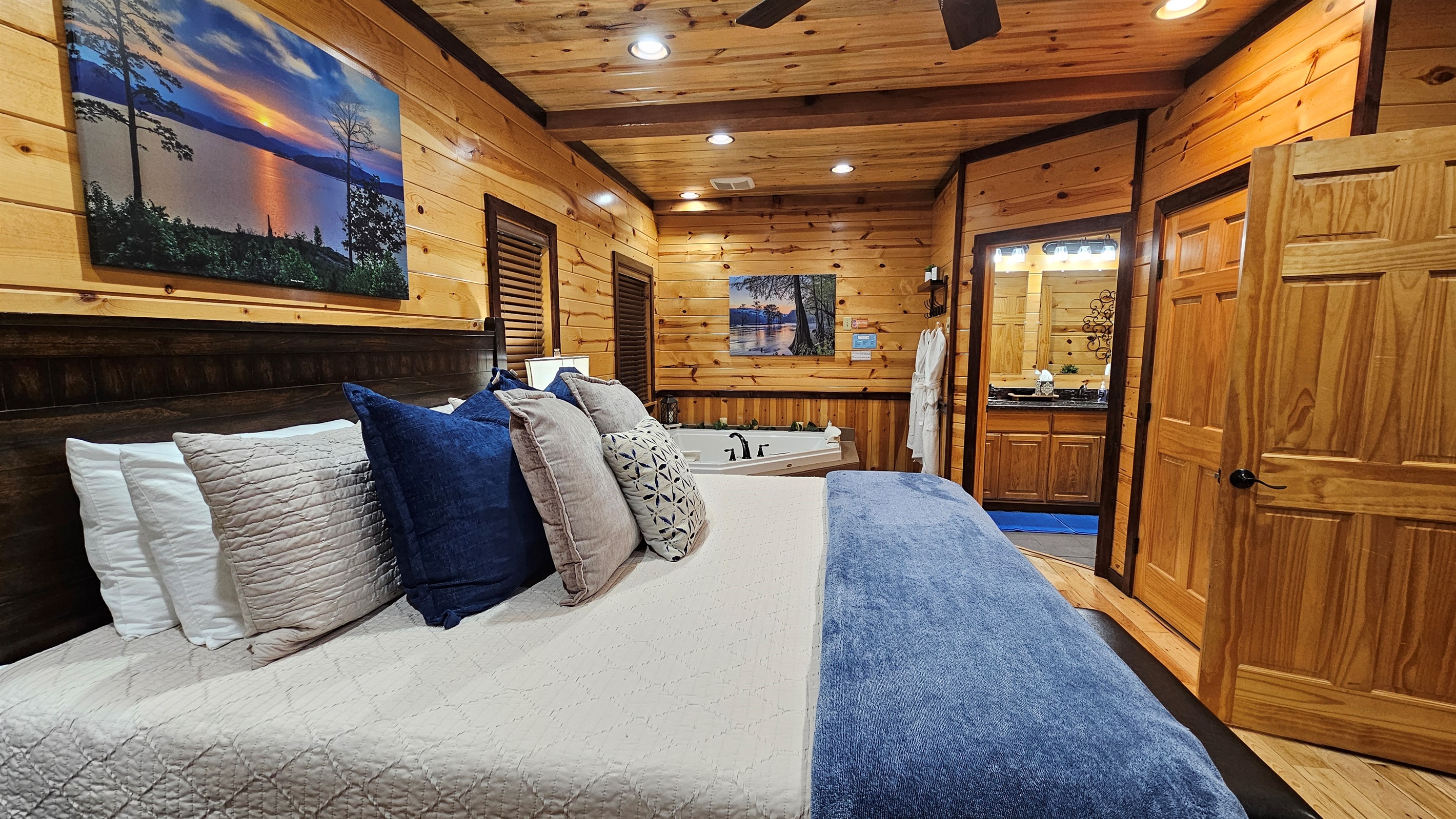 Cozy king bedroom featuring a relaxing jacuzzi tub and easy access to the en‑suite bath.