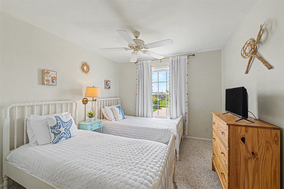 Bedroom with two twin beds, smart TV