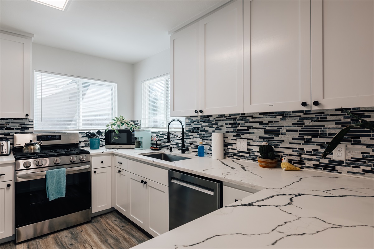 full stocked kitchen has everything you need for coffee, cooking, baking.