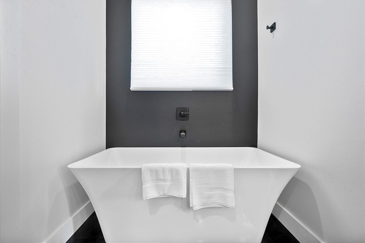 The primary bathroom is spacious with both a soaking tub and walk-in shower, offering a little spa-like escape for ultimate relaxation.