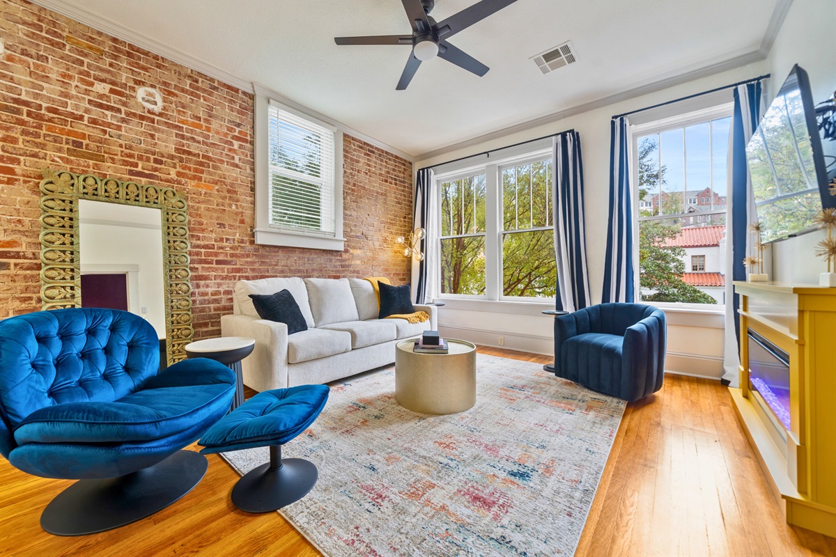 A cozy living area filled with colorful accents and natural light, perfect for unwinding after a day of adventure.