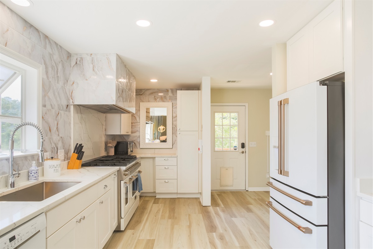 Spacious chef’s kitchen with stainless steel appliances and plenty of counter space.