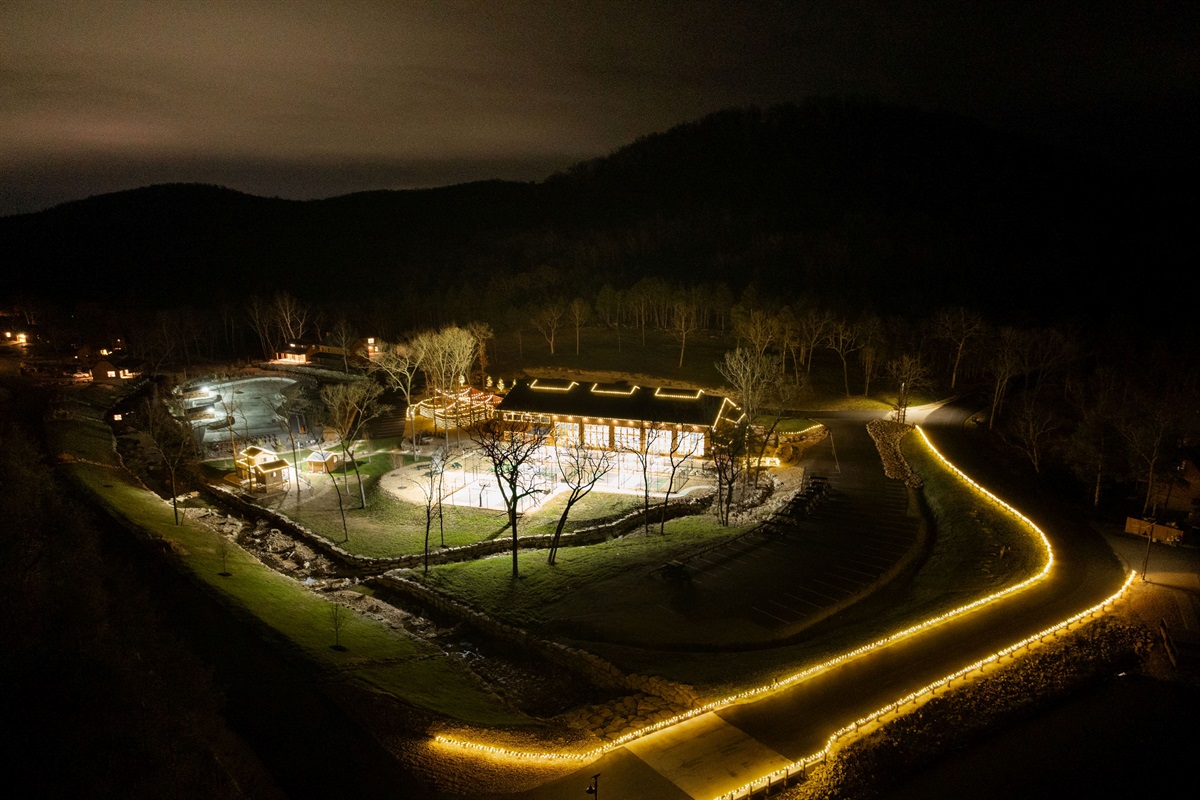 Peaceful nighttime aerial view of the property and surrounding area.