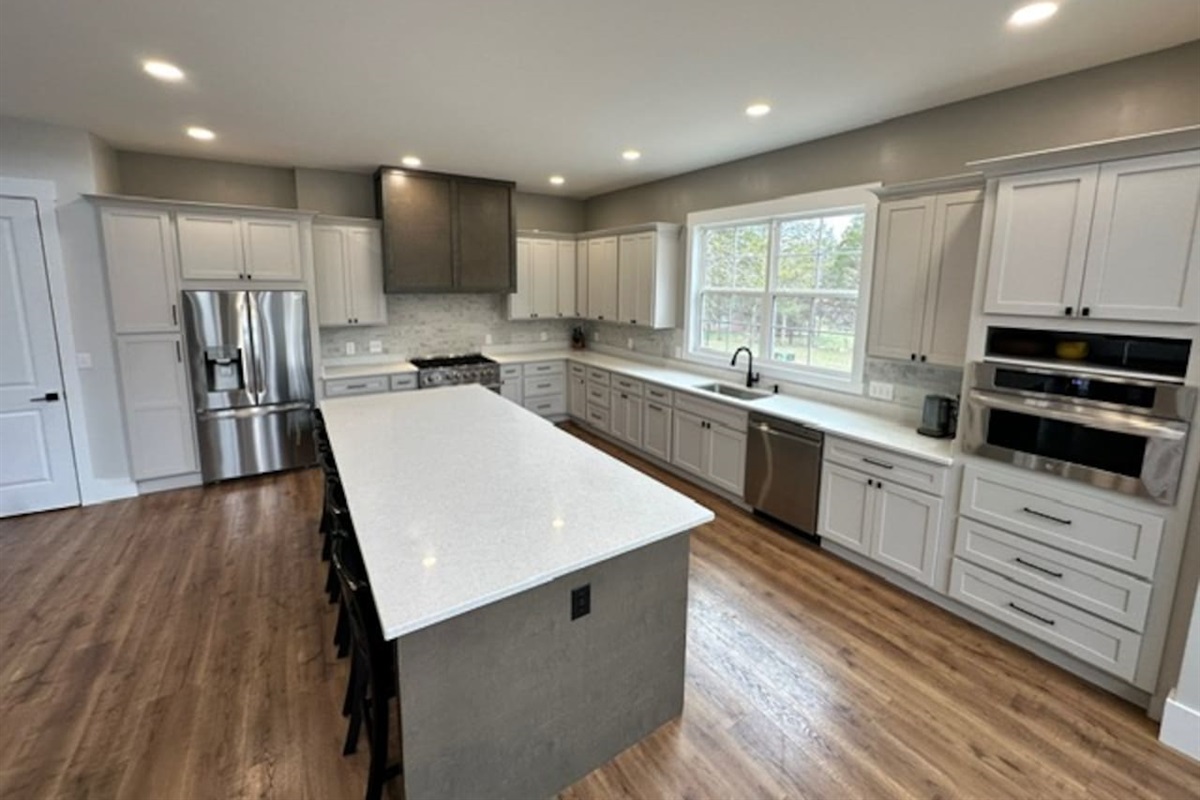 Island seats 5 with an additional two stools in the dining area. Kitchen table upgrade coming soon to accommodate even more guests. Plenty of pantry space, kitchen appliances, dishes, mugs, etc.