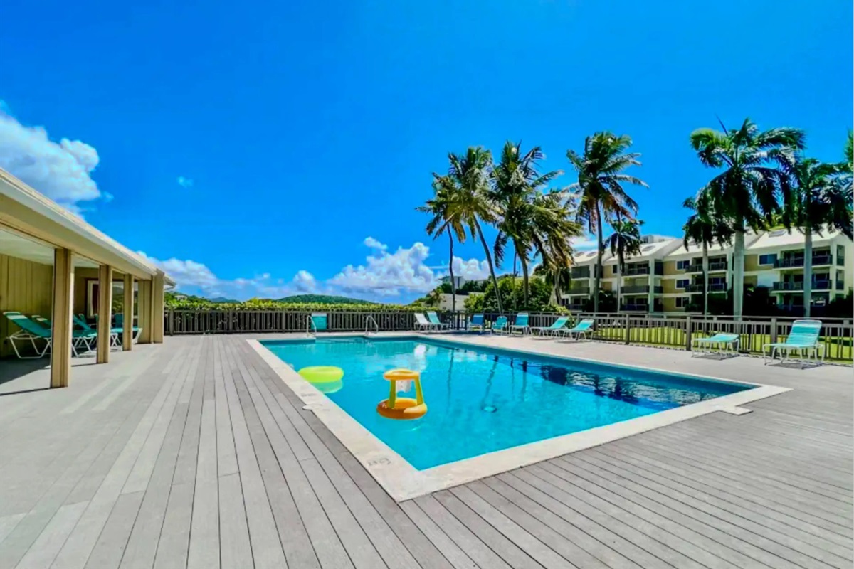 Spacious pool area designed for relaxing, lounging, and enjoying the tropical atmosphere.