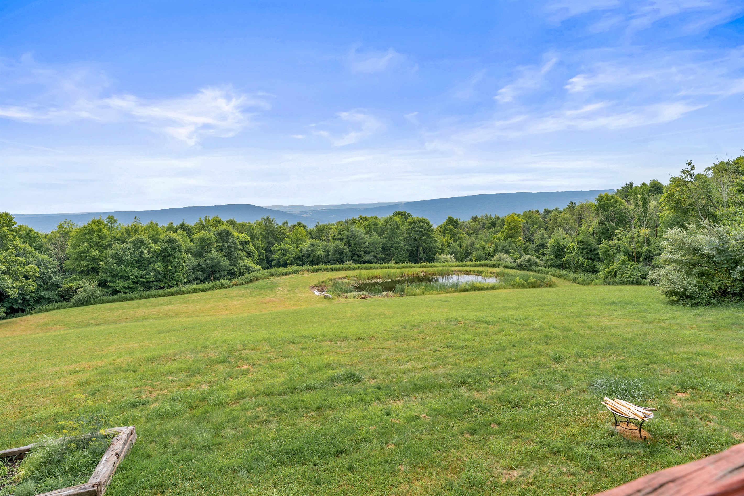 Soak in the sweeping mountain views and tranquil private pond—perfect for peaceful mornings and wildlife watching