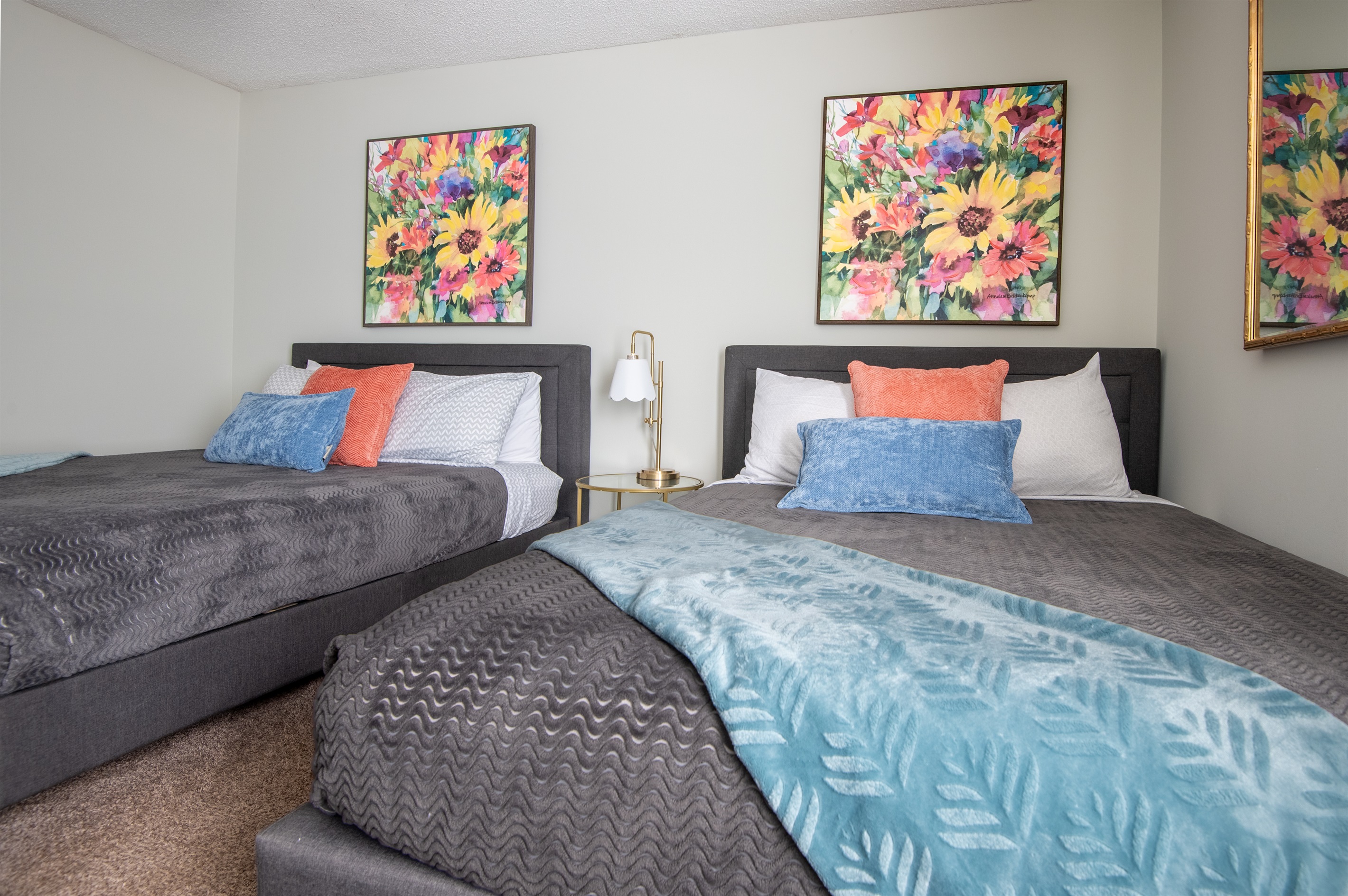 The double queen room has plenty of space for up to 4 people and even has an extra place to sit and read if you so choose.