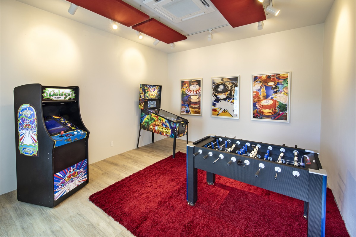 Arcade room with foosball, pin ball and pac man 