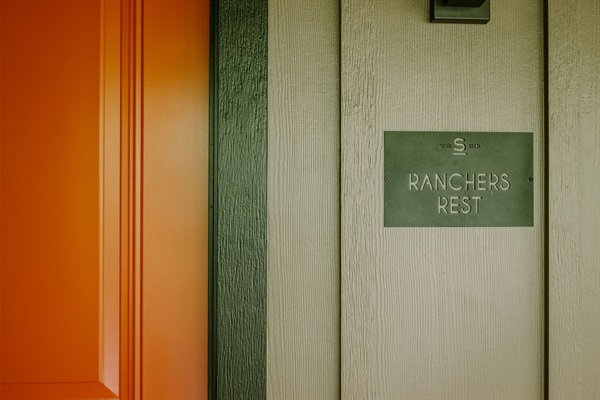 The private entrance to Rancher's Rest at Gaines Ranch on the Square &mdash; smart-lock self check-in, no front desk, no waiting.