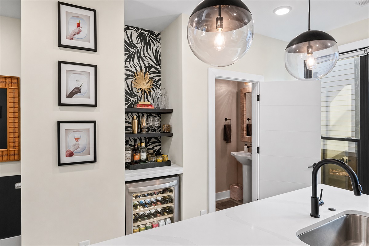 Everything you need for a great night in&mdash;wine fridge, glassware, and a dedicated space to mix, pour, and relax.