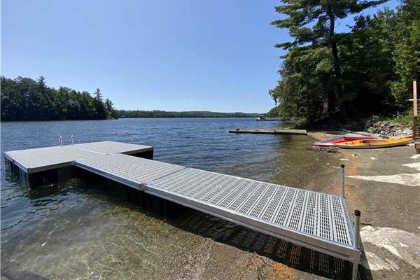 Dock and beach with westward view of Lac McGregor.