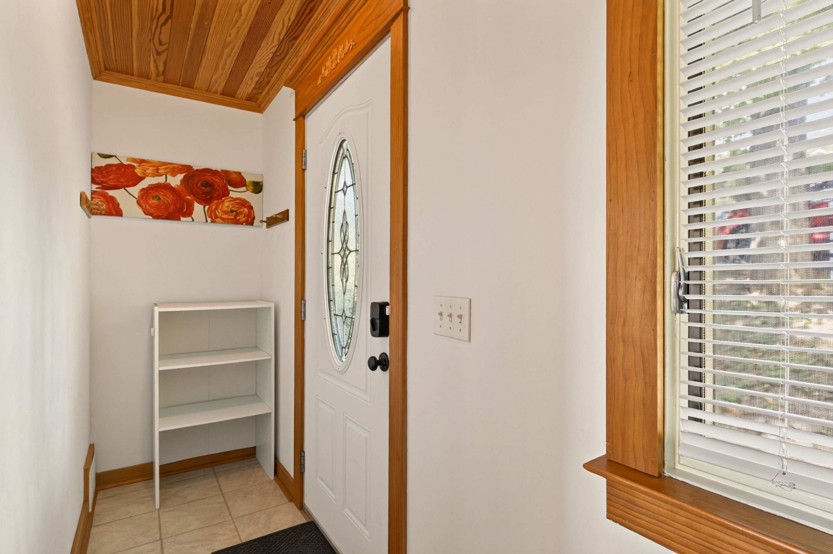 Main entrance hallway with white shoe rack