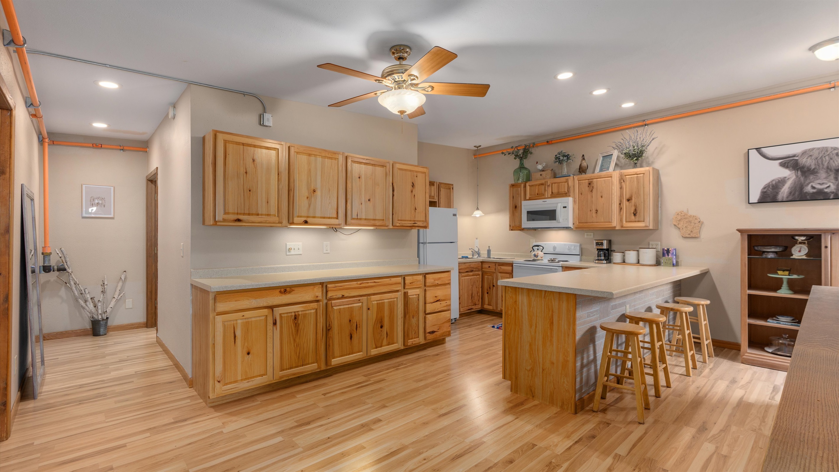 The large kitchen is fully stocked for all your cooking and gathering needs.