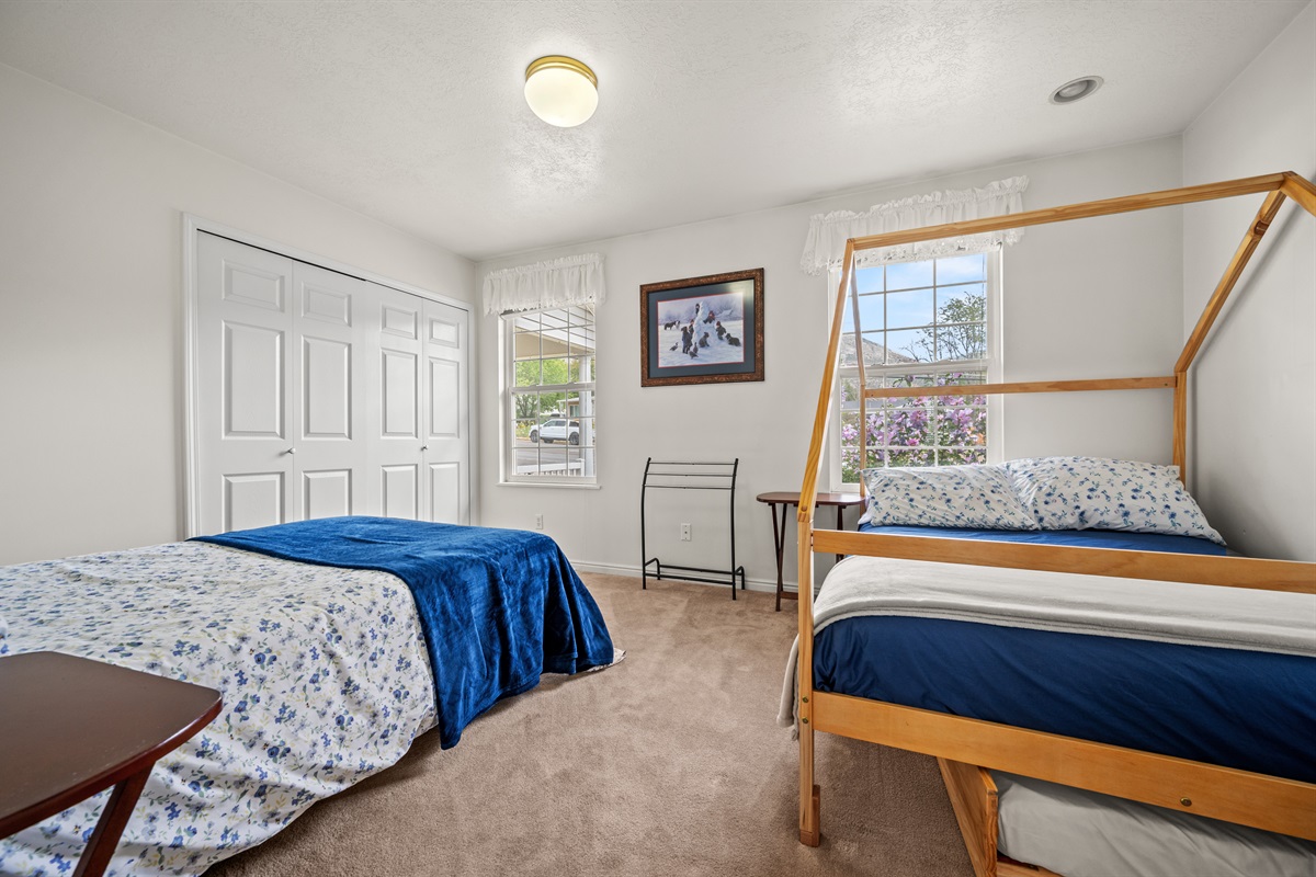 Bright and cozy guest bedroom perfect for kids or multiple guests.