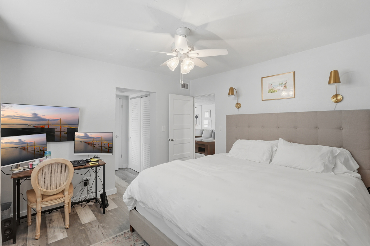 Unwind in the comfort of the primary bedroom, offering a peaceful retreat where you can recharge after a sunny day exploring St. Pete Beach.
 Need to catch up on work during your stay? The dedicated workspace provides a convenient spot to stay productive