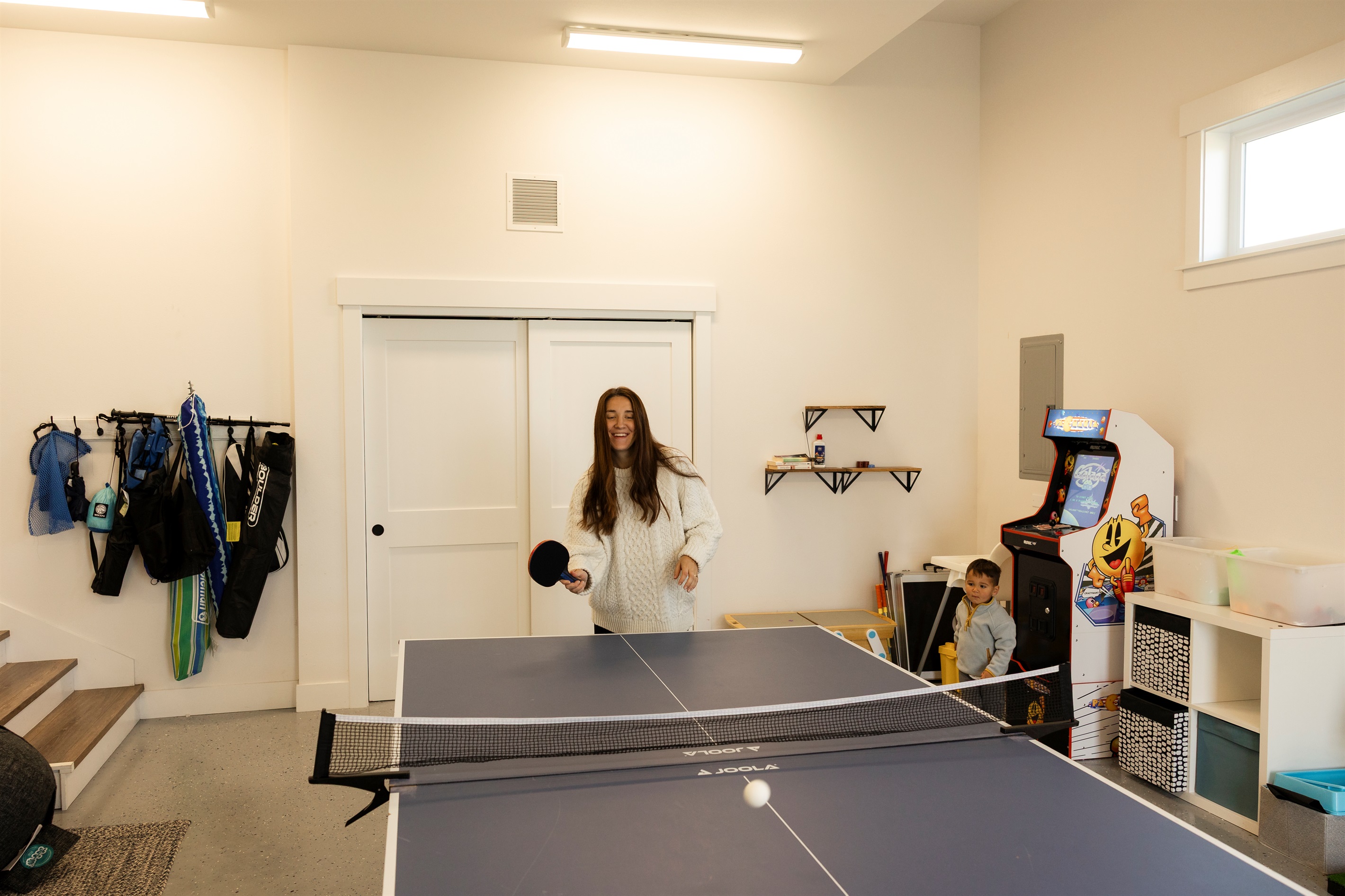 {Game Room} Family fun starts here: ping pong showdowns, Pac-Man high scores, and endless laughs.