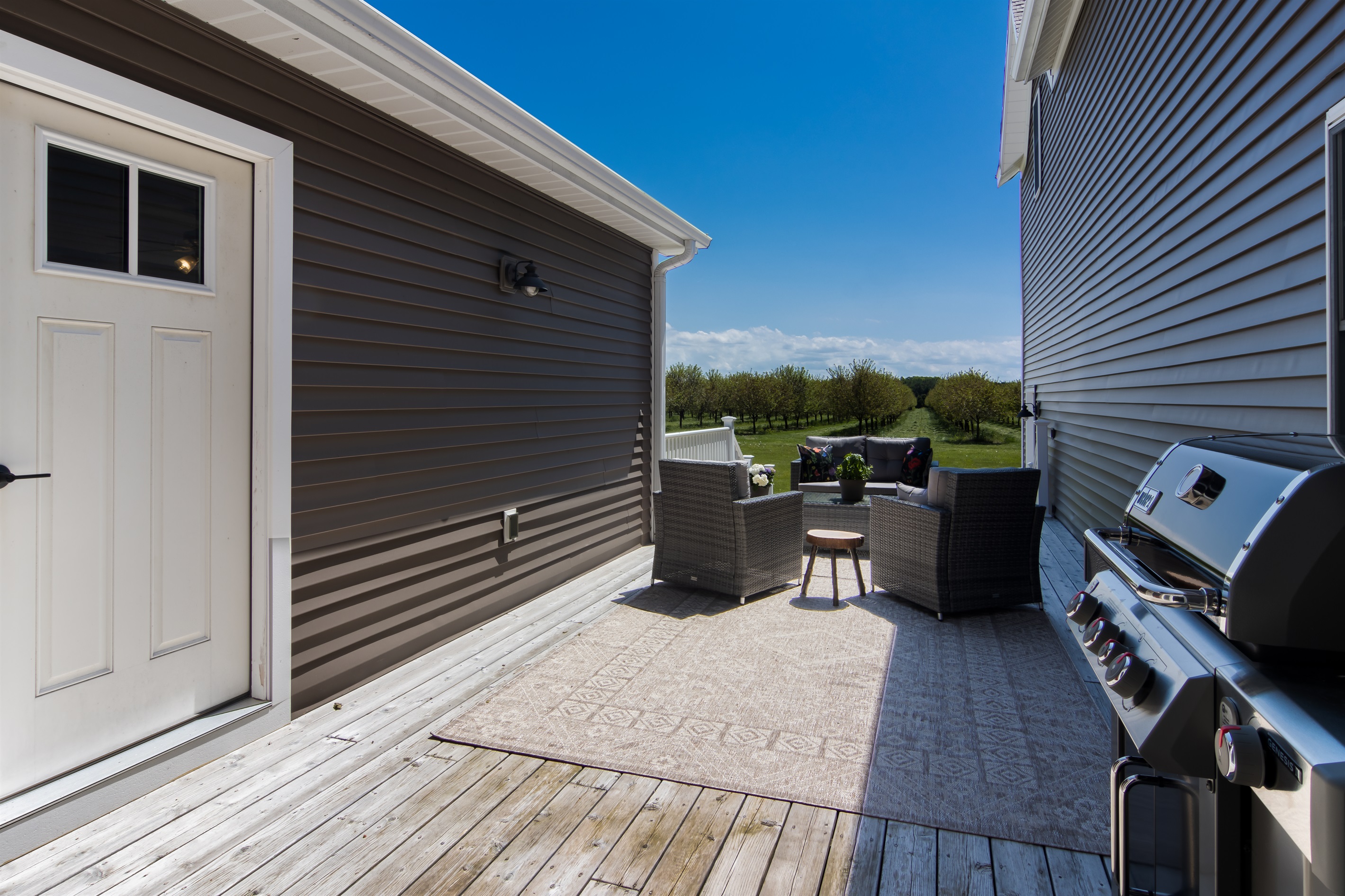Additional grilling area with table and chairs.