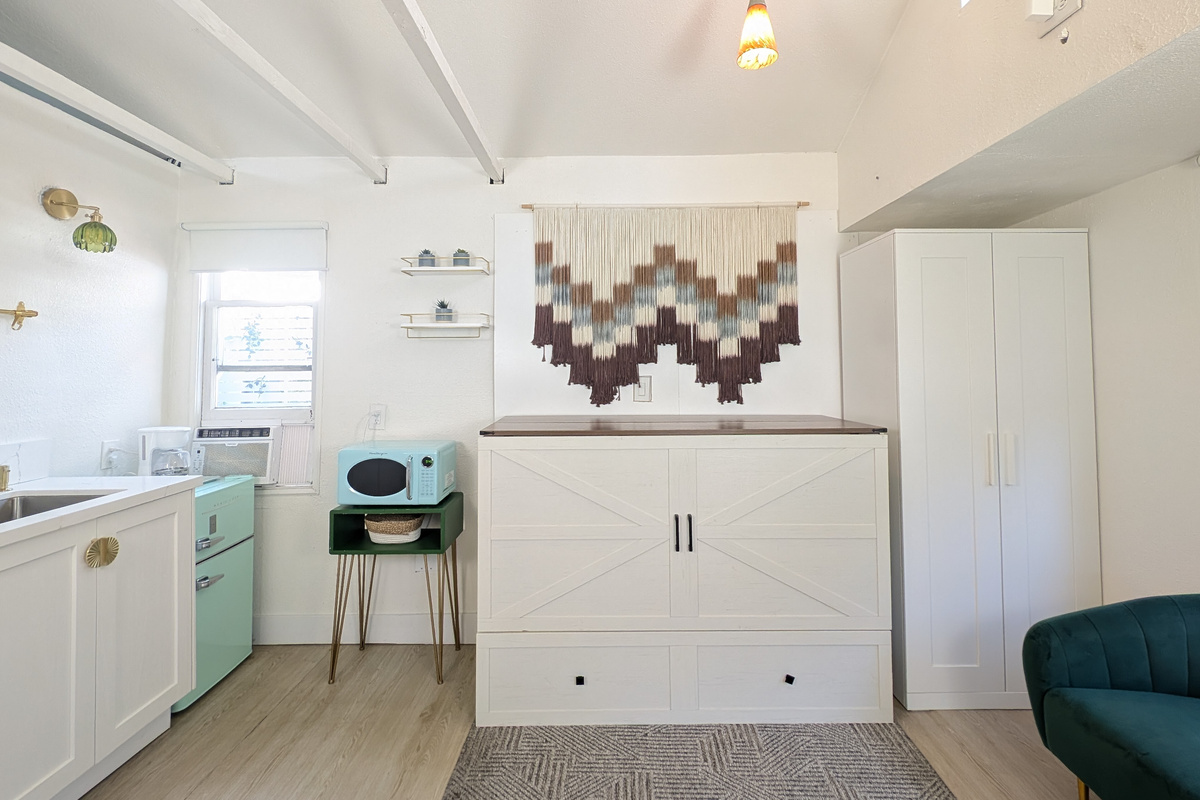 Queen Murphy bed folds away to maximize space.