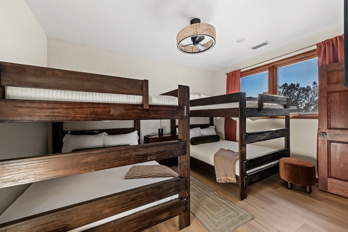 Bedroom 8:
Queen-over-queen bunk room with natural light and warm, modern design.