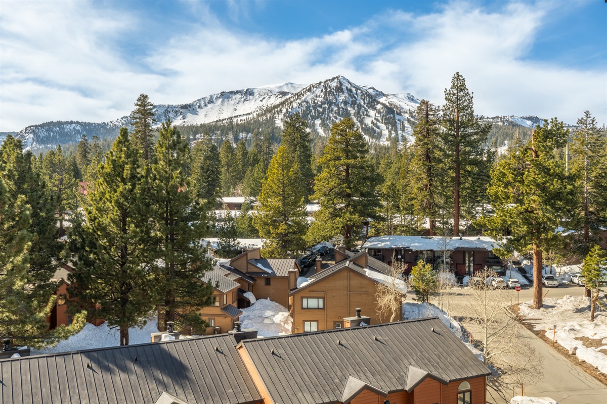 The living room window and private balcony both offer calm, expansive views of LIncoln and Mammoth Mountains and the Sherwin Range.