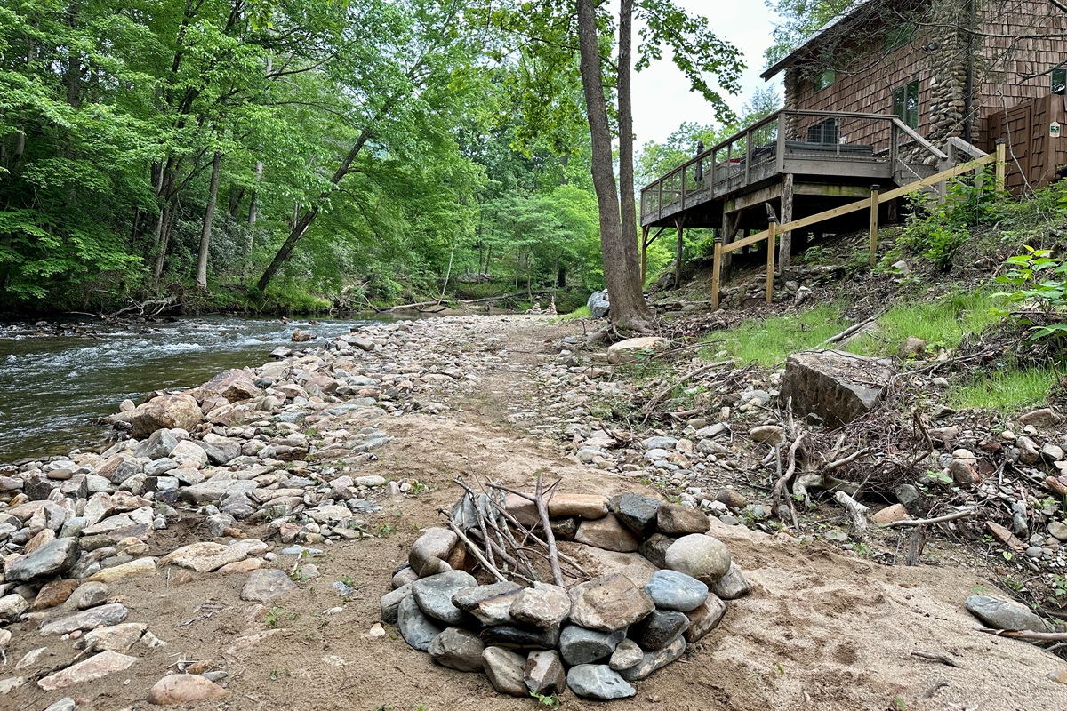 Firepit is located in a little private area below the cottage on the creek.