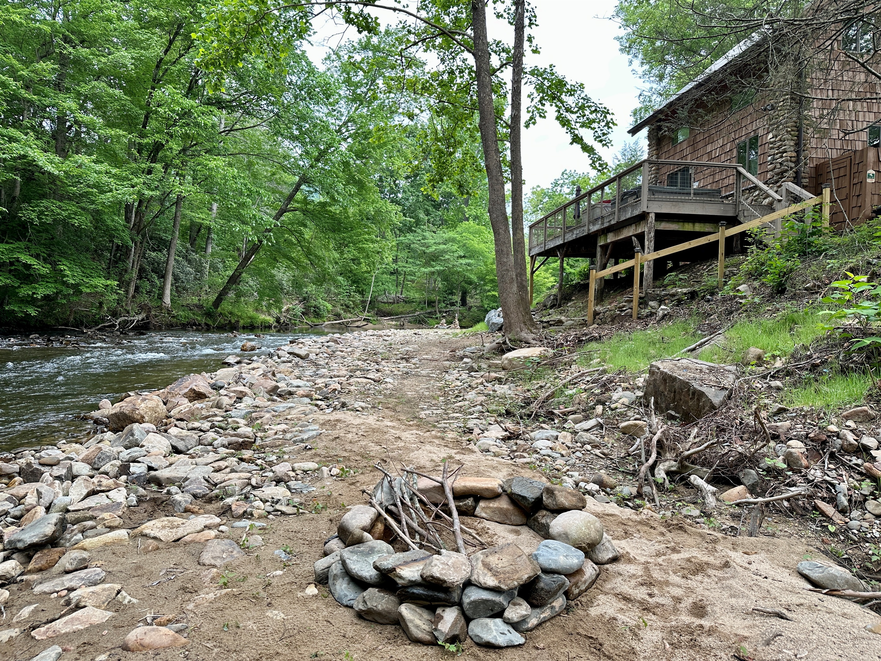Firepit is located in a little private area below the cottage on the creek.