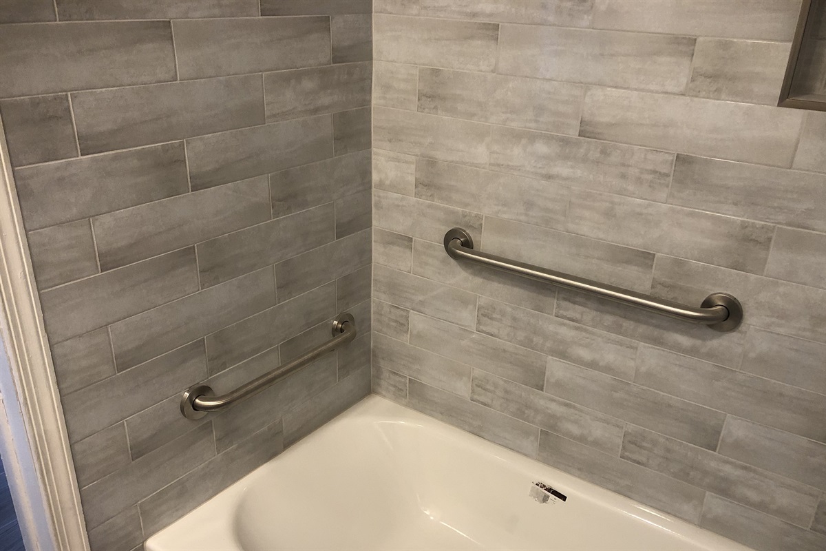 Bathroom 2 with grab bars in shower/tub.