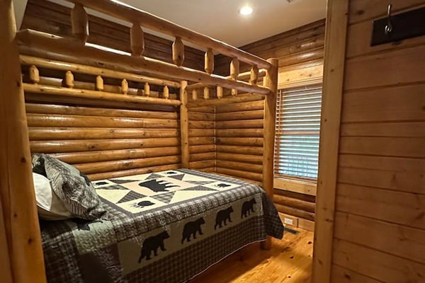 Bedroom #3 on upper level of the cabin / queen sized bed