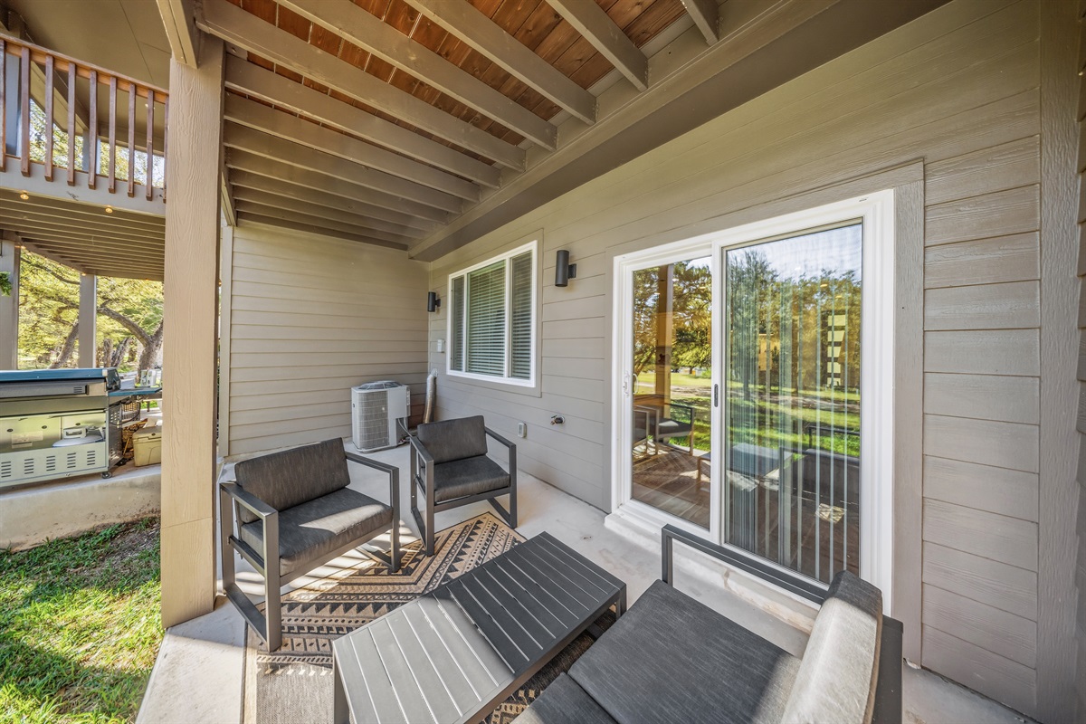 Downstairs patio with outdoor seating overlooking the golf course