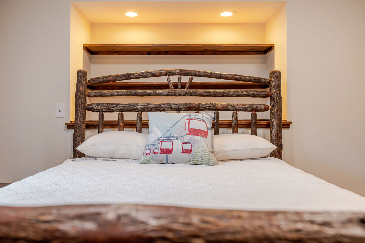 Drift off in the unique handcrafted log bed, adding authentic Adirondack character to this inviting retreat.